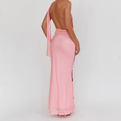 Pink one-shoulder dress with a slit on a plain background