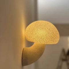  The Golden Atelier White Mushroom Wall Sconce illuminating a balcony, casting a soft, warm glow. 4