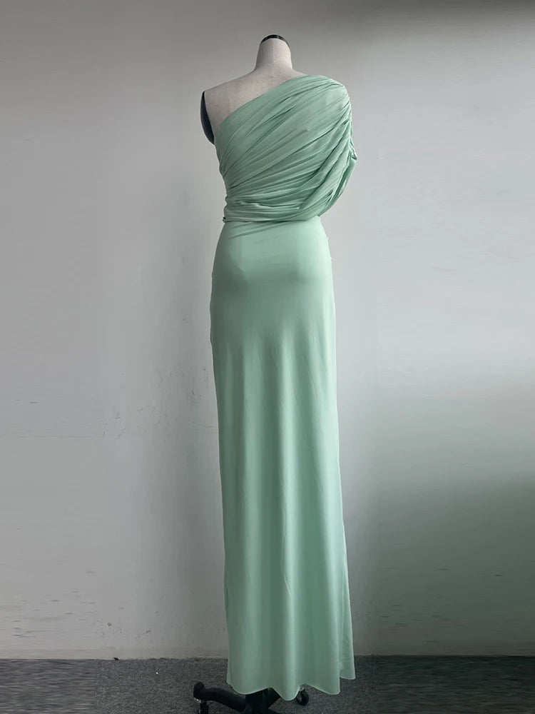 Mint green one-shoulder evening gown on a mannequin against a plain background