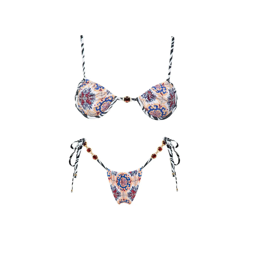 Close-up of the patterned bikini top, highlighting the print and embellishments.