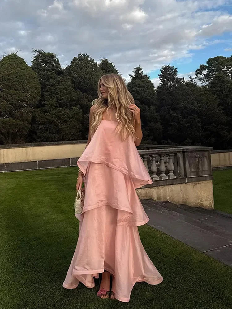 Strapless ruffle maxi dress in a garden setting