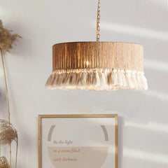 The Golden Atelier Vintage Hemp Rope Tassel Pendant Light hanging in a cozy bedroom, creating a warm and inviting atmosphere. 2