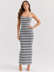 Striped strapless maxi dress with hand on hip
