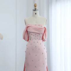 Mannequin displaying a beautiful baby pink off-the-shoulder evening gown, perfect for special occasions. Golden Atelier 4