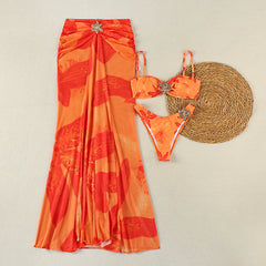 Printed mesh skirt and bikini set arranged for display