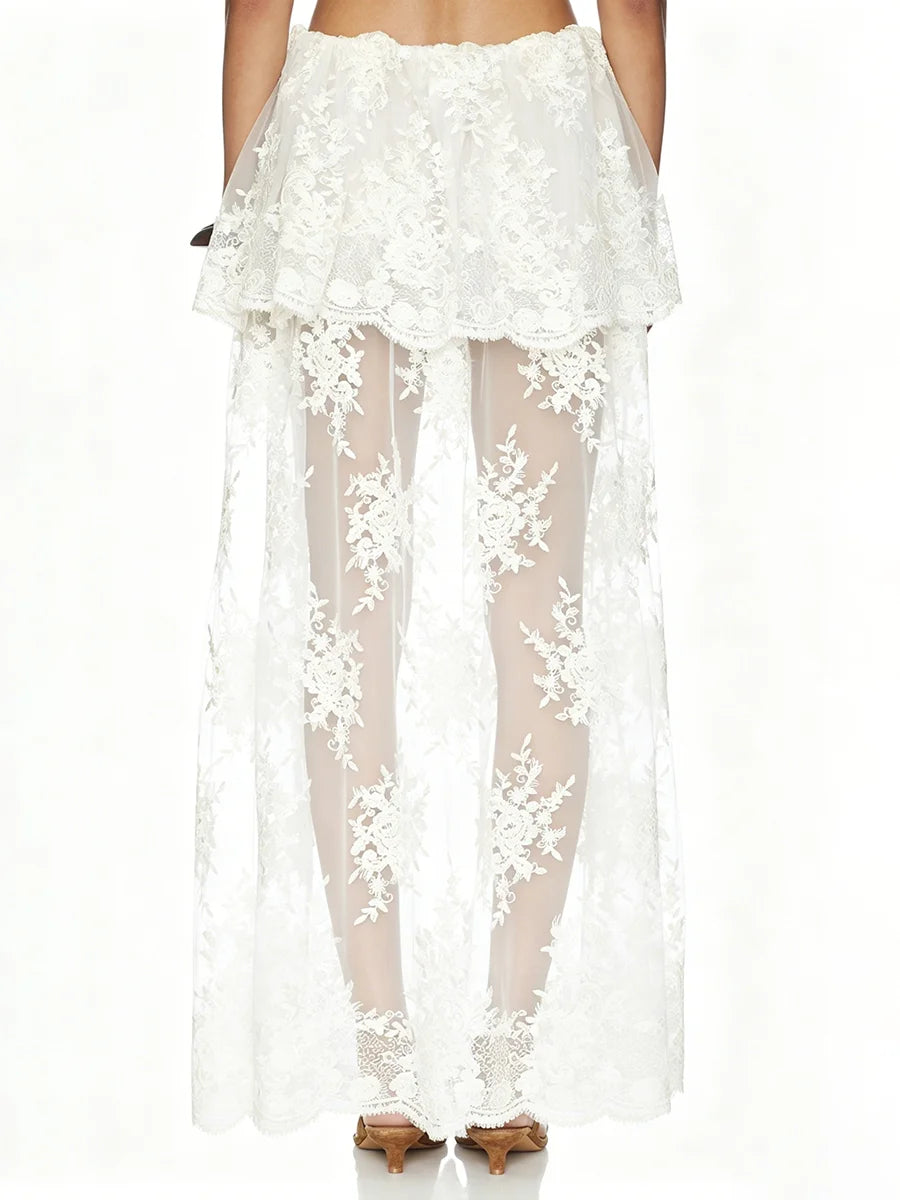 Back view of white floral lace high neck sleeveless crop top and sheer maxi skirt set
