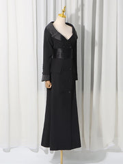 Black double-breasted maxi blazer dress on a mannequin, side view