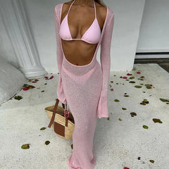 Close-up of a ribbed knit long sleeve cover-up and bikini bathing suit set.