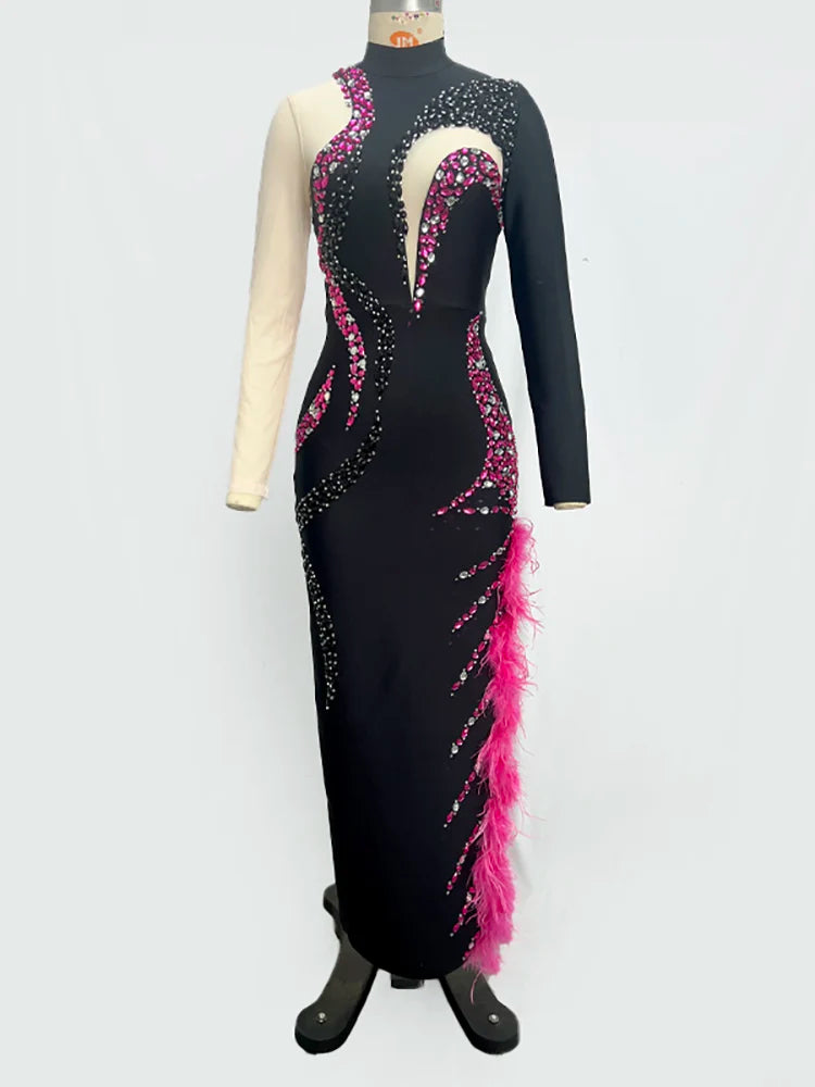 Black dress with pink and white accents on a mannequin against a white background