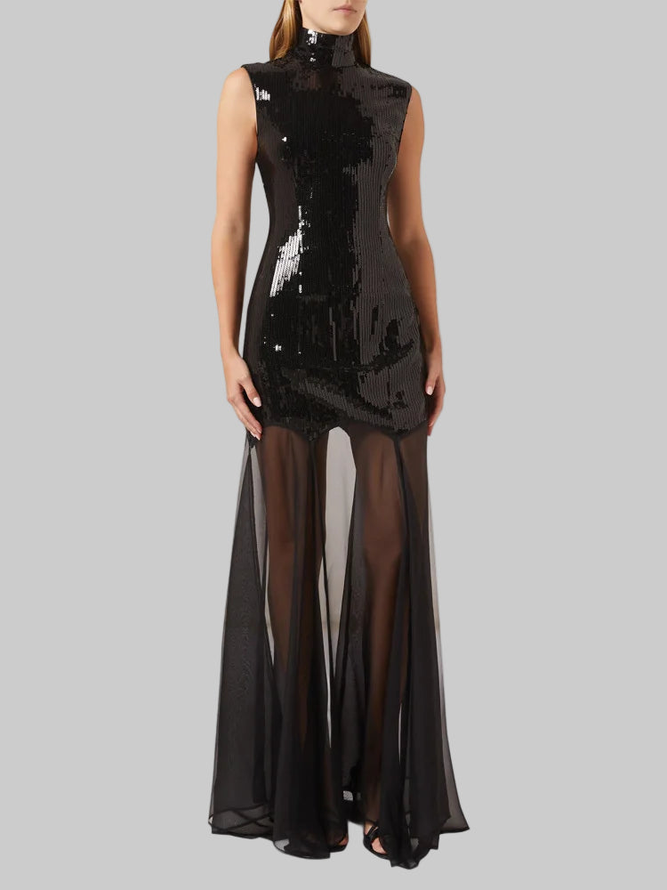 Black sequin dress with sheer overlay on a white background