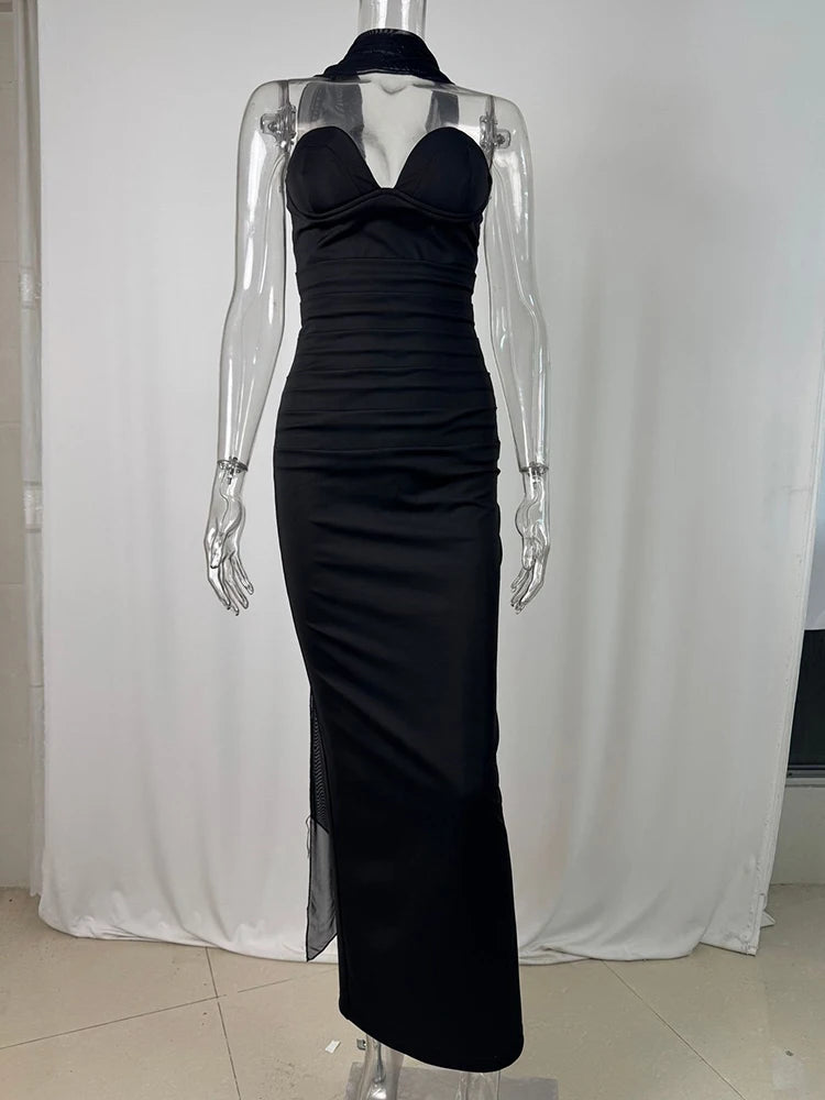 Black evening gown on a mannequin against a white background