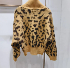 Leopard print coat on a hanger