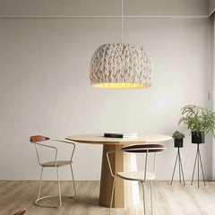 The Golden Atelier Wabi Sabi Rope Chandelier hanging above a reading table, creating a warm and inviting atmosphere. 1