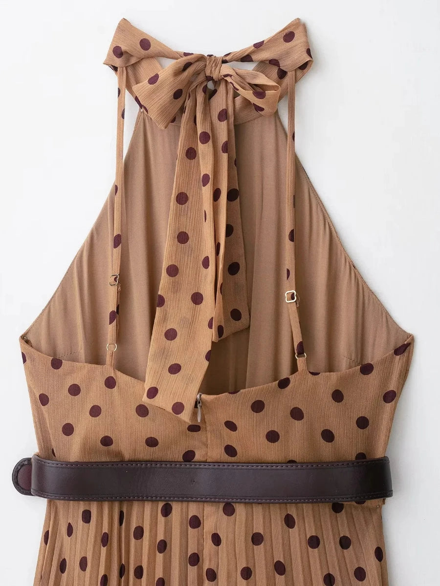Brown polka dot halter top with a belt on a white background