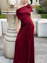 Close-up of draped detail on one shoulder dress