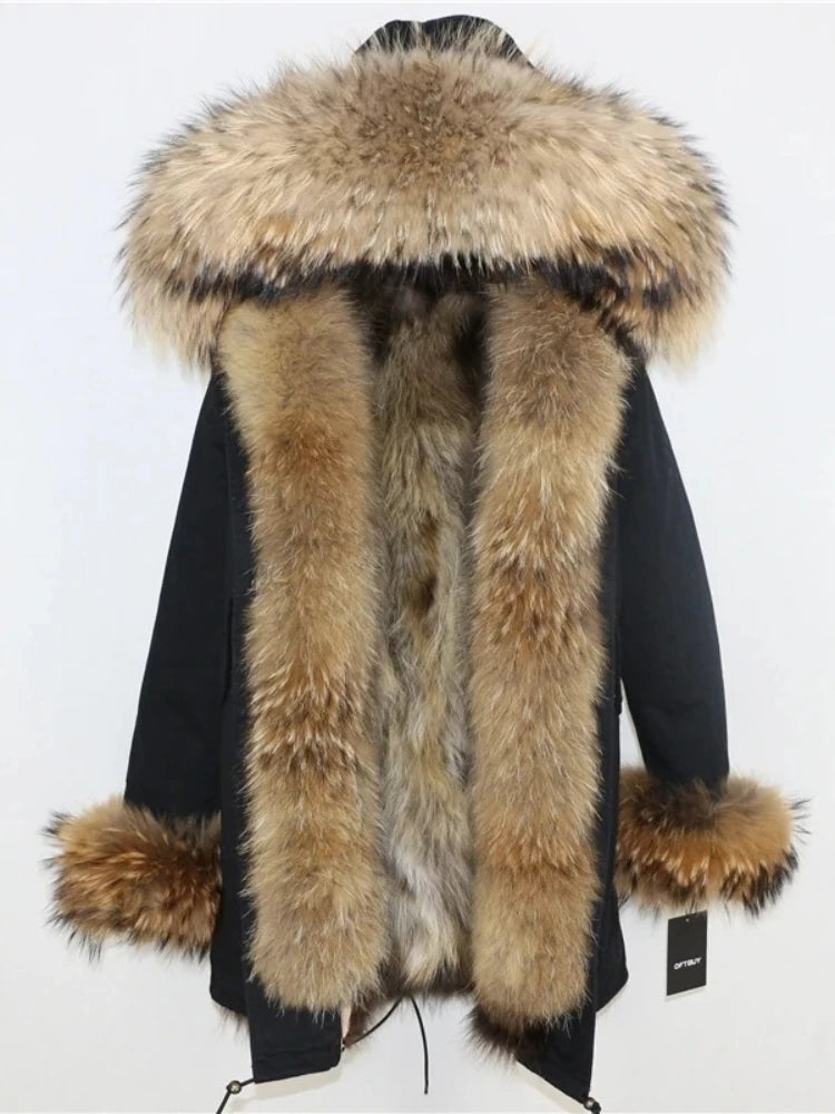 Black coat with large fur hood and fur trim on a white background