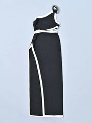 Black and white one-shoulder dress on a light blue background