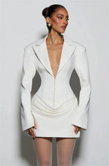White blazer dress worn by a model on a plain background