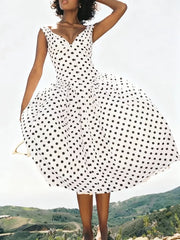 White sleeveless polka dot dress shown with a flared A-line skirt.