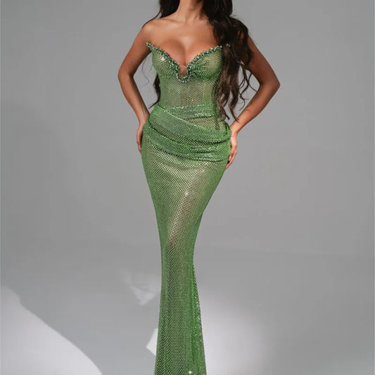 Green sequin strapless mermaid gown styled for evening elegance
