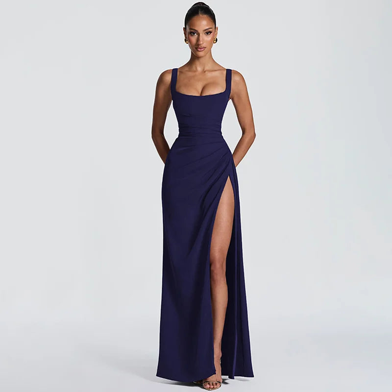 Navy blue evening gown with a high slit on a white background