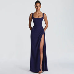 Navy blue evening gown with a high slit on a white background