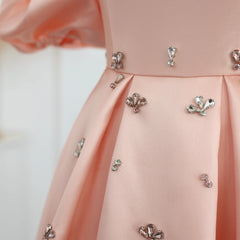 Close-up of the crystal detailing and cap sleeves on the blush pink satin gown.  Golden Atelier 4