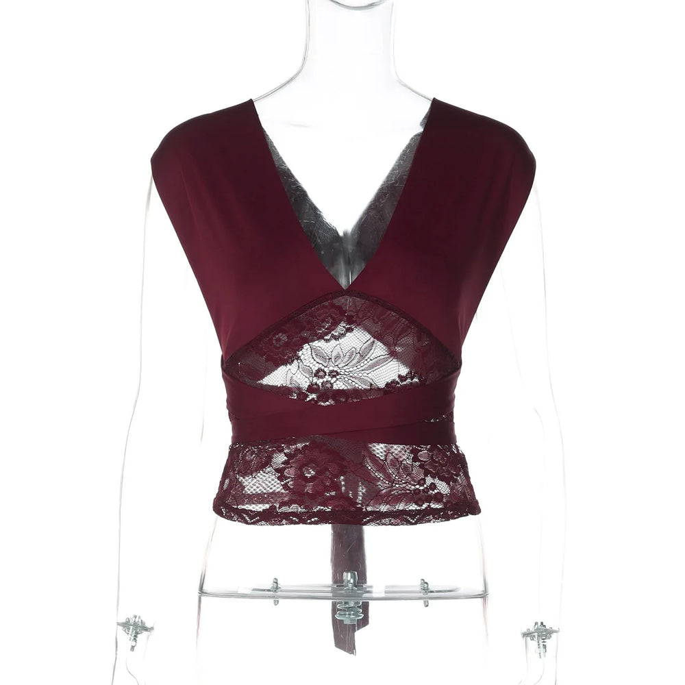 Maroon lace top on a mannequin against a white background