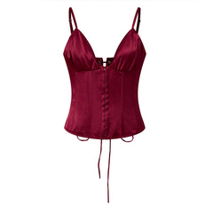Red satin corset on a white background
