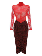 Red lace top and black ruched skirt on a white background