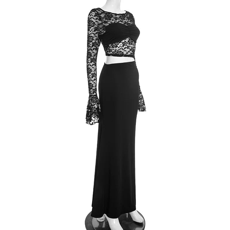Black lace top and long black skirt on a mannequin against a white background