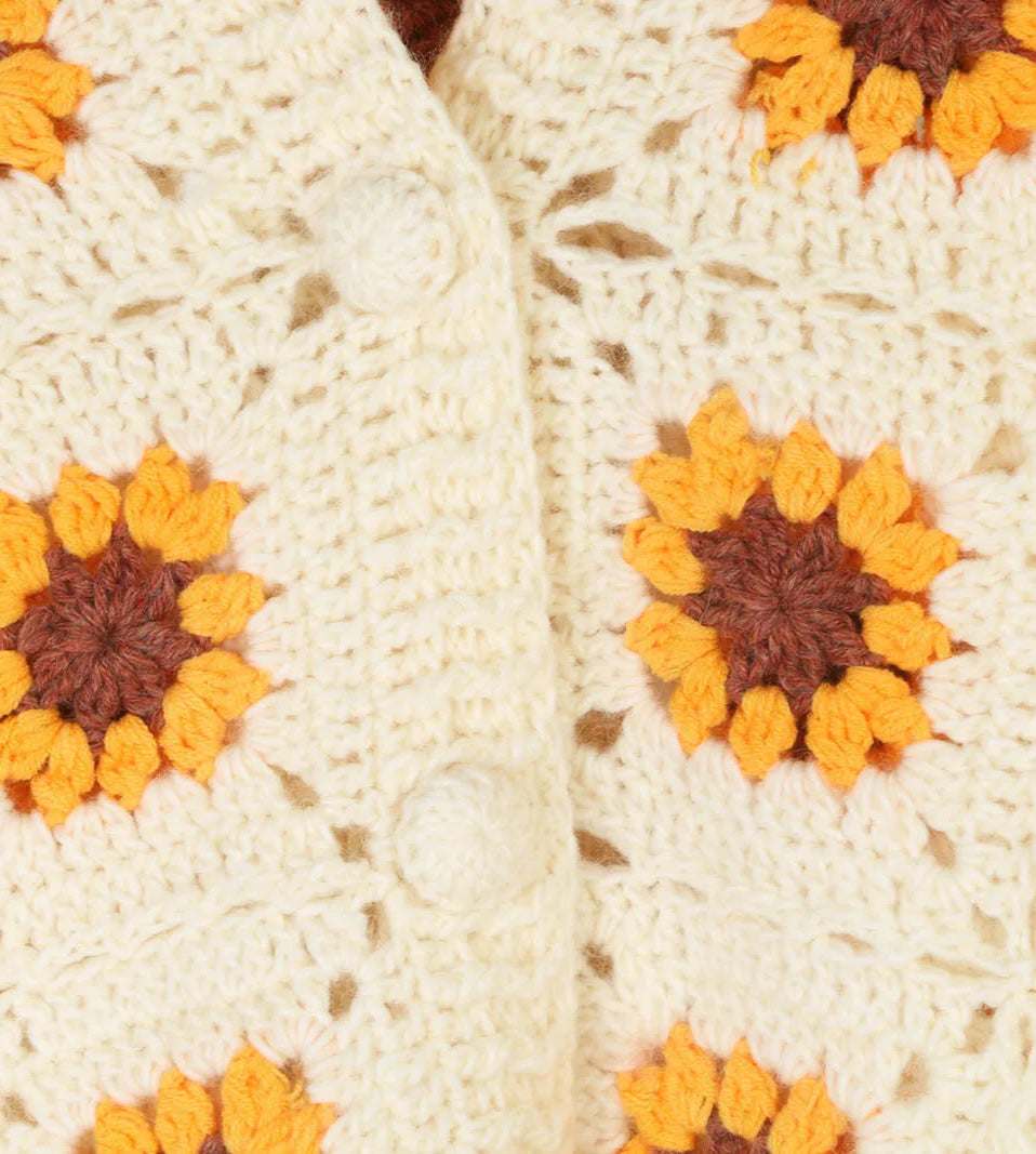 Close-up of a crocheted blanket with sunflower pattern