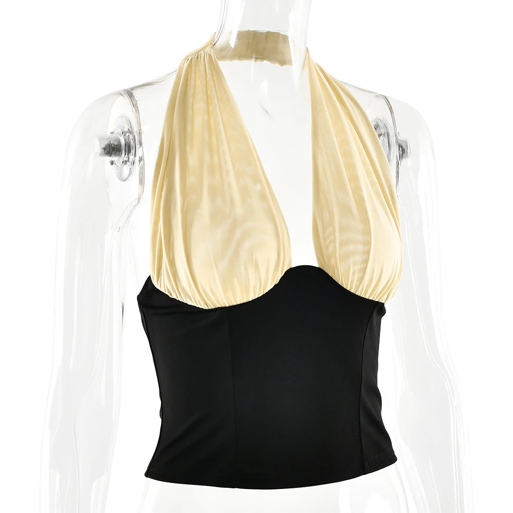 Black and beige halter top on a mannequin against a white background