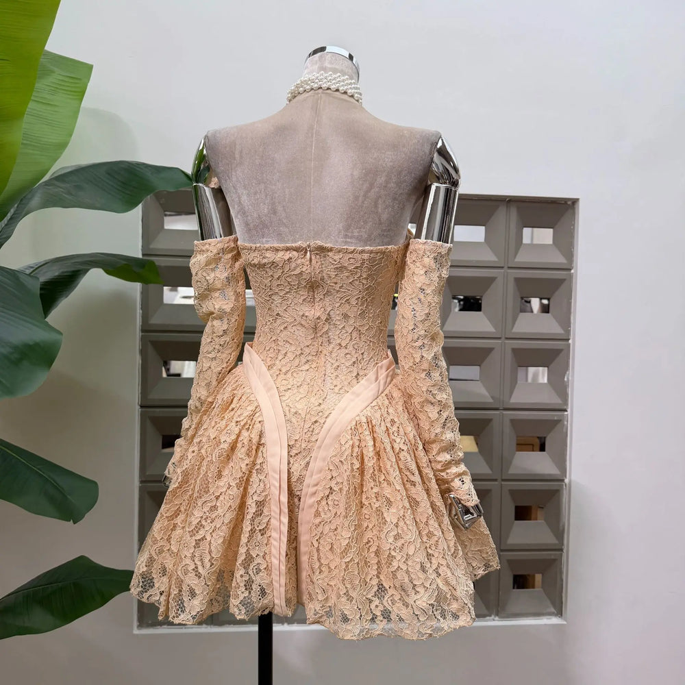 Back view of peach lace bow off-shoulder mini dress with long sleeves
