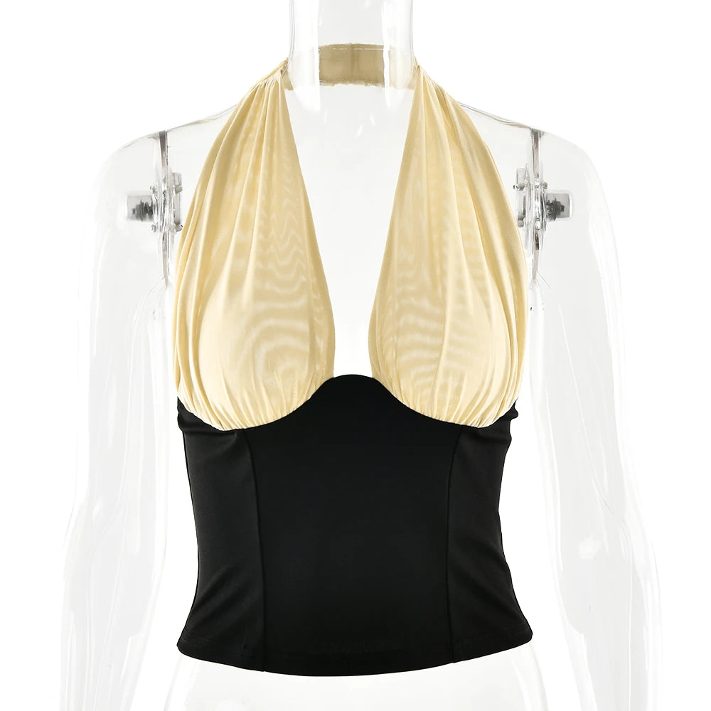 Black and beige halter top on a mannequin against a white background
