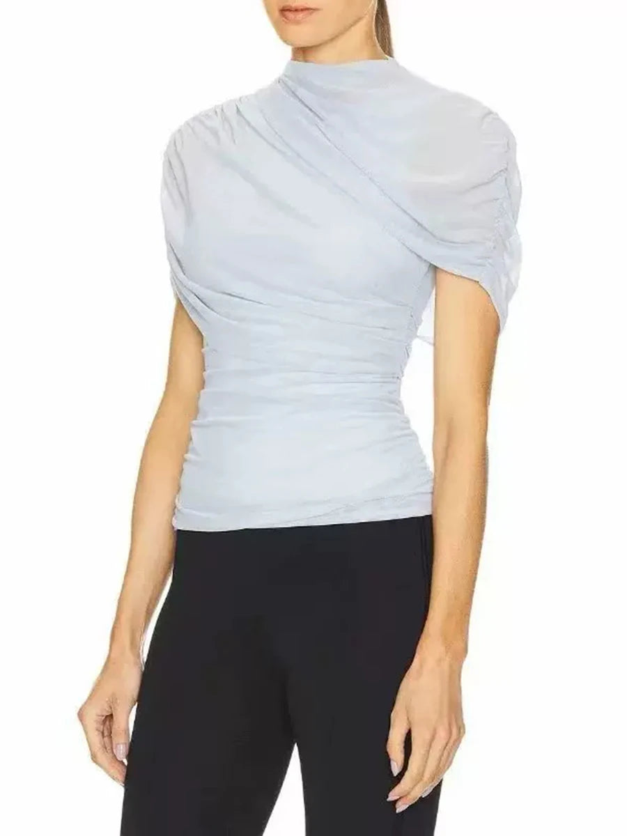 Three-quarter view of draped mock neck short sleeve top