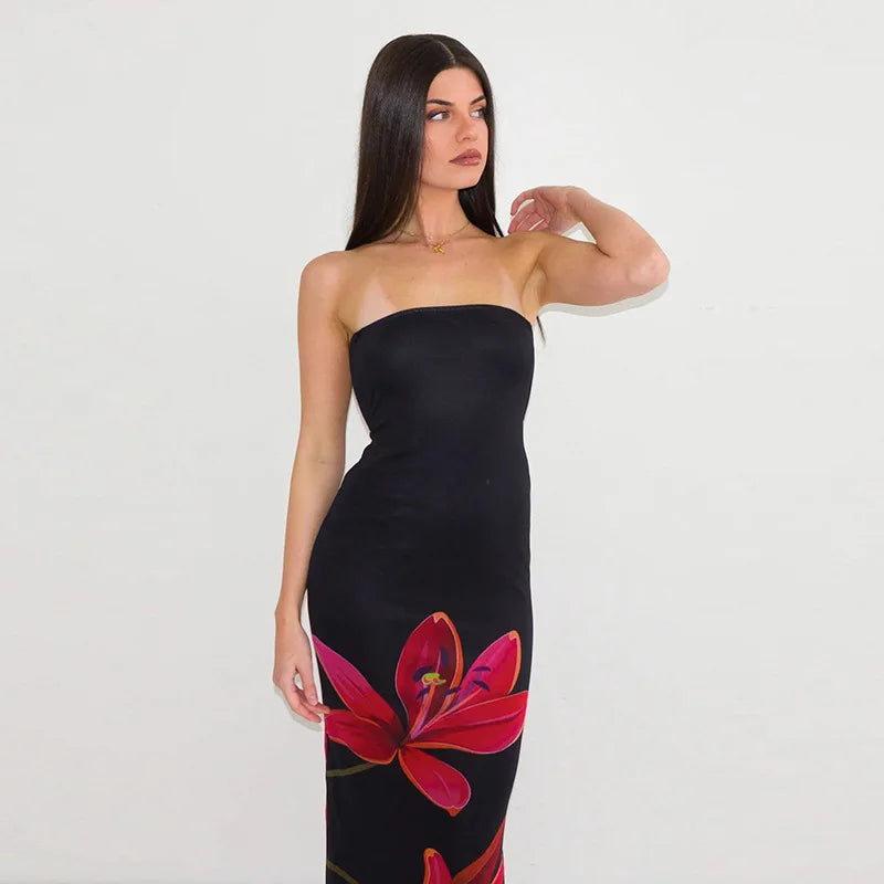 Woman wearing a black strapless dress with red floral design