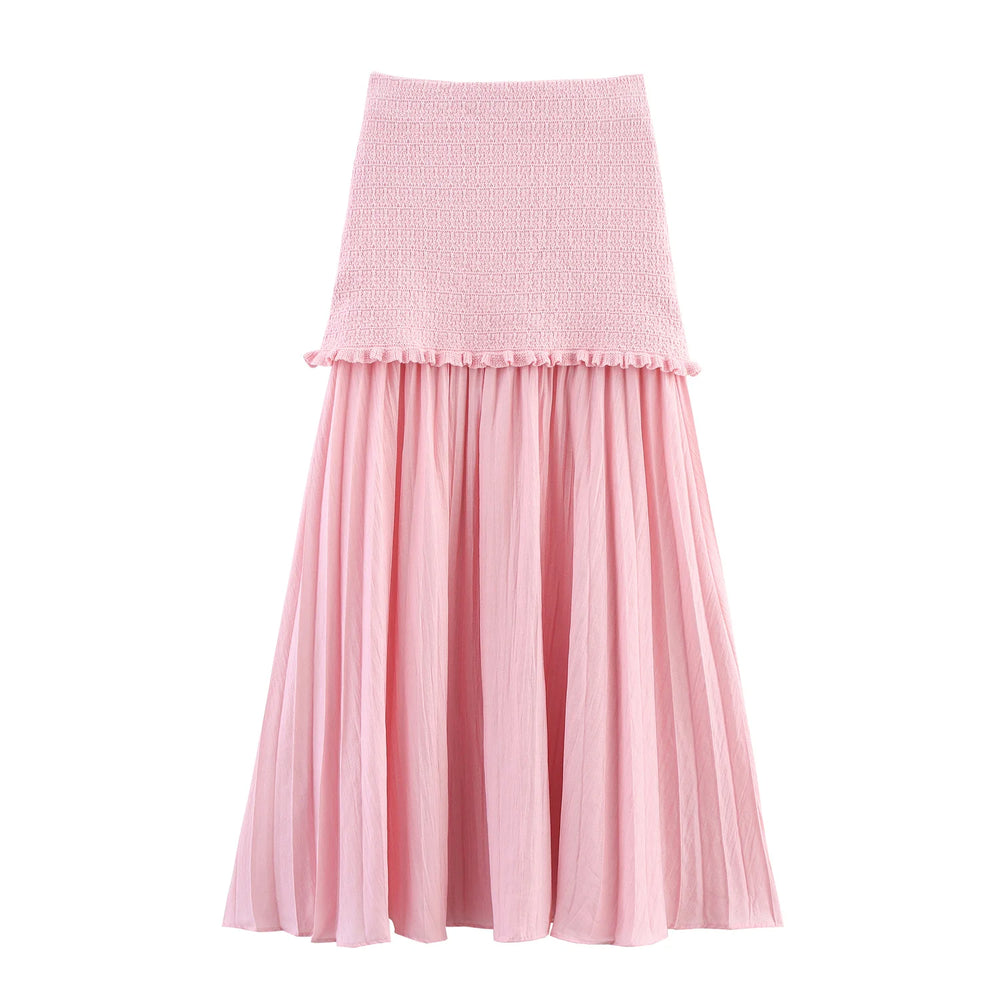 Pink skirt with a textured top and pleated skirt on a white background