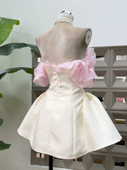 Back view of strapless mini dress with flared skirt