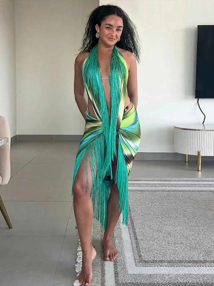 Woman wearing a printed halter fringe maxi dress indoors