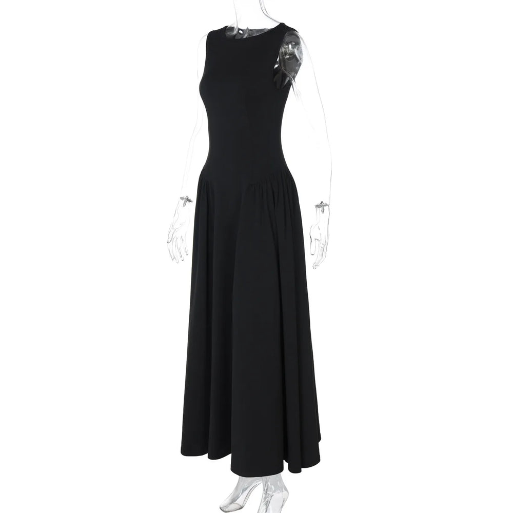 Black sleeveless dress on a mannequin against a white background