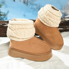 Pair of brown winter boots with white textured cuffs on a snowy background