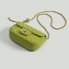 A stylish crossbody bag with an adjustable shoulder strap and a unique ball detail, showcased against a neutral background.