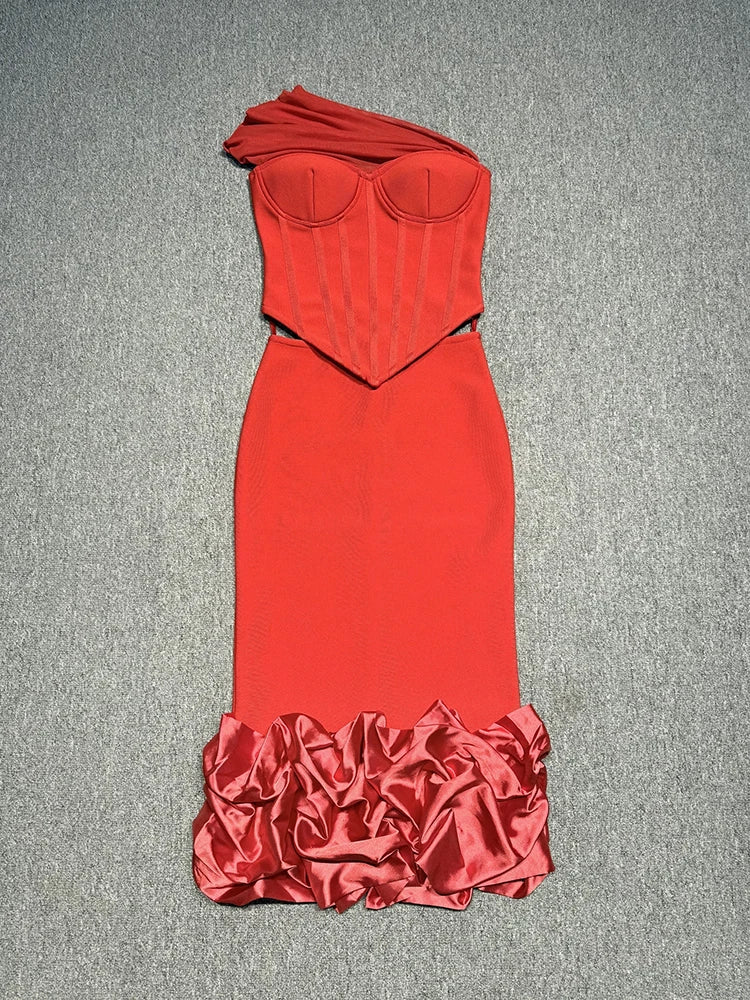 Red strapless dress with ruffled bottom on a gray background