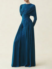Long blue evening gown on a plain background