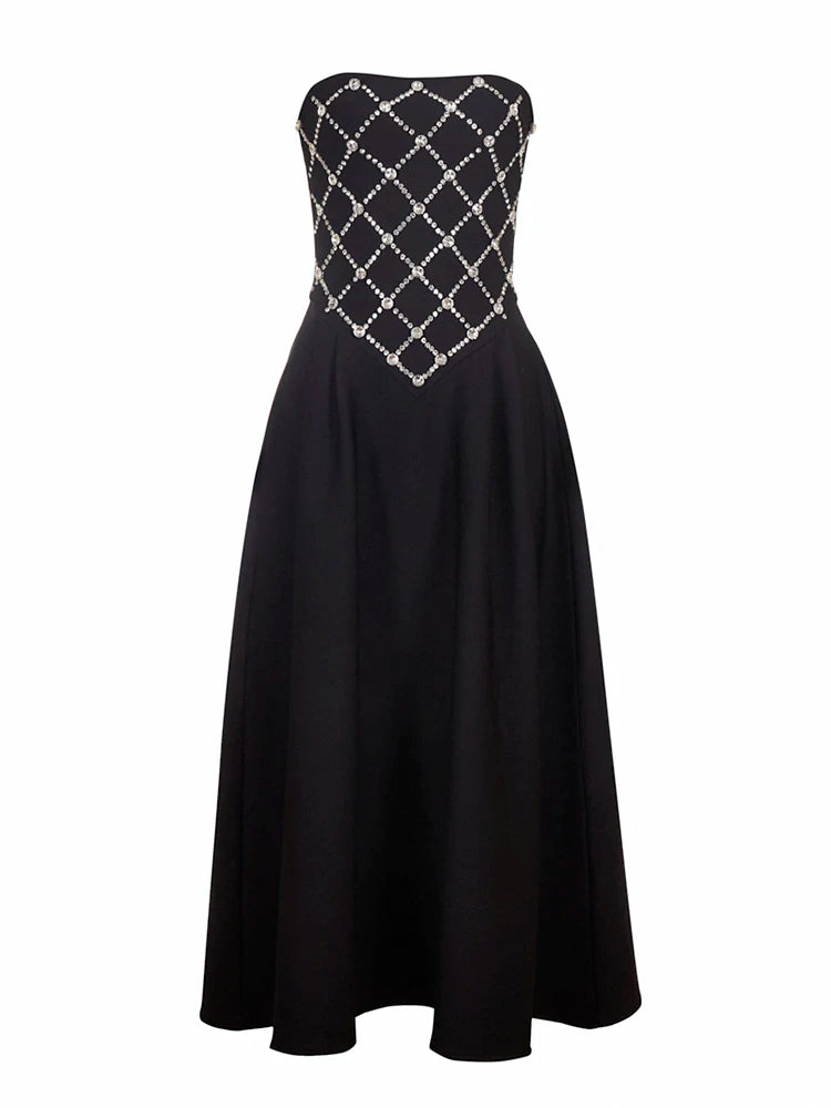 Black strapless dress with silver embellishments on a white background