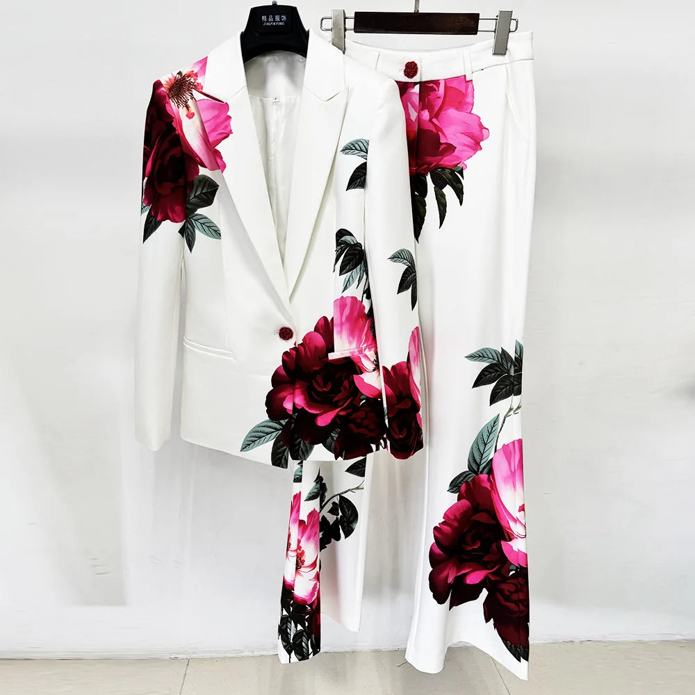 Floral print blazer and flare pants suit on hangers.