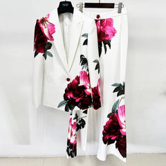 Floral print blazer and flare pants suit on hangers.