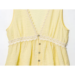 Yellow sleeveless dress with lace details on a white background