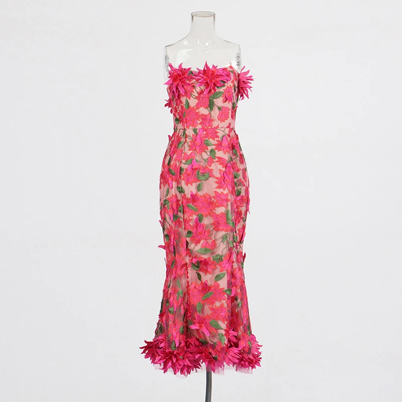 Pink floral dress on a mannequin against a white background